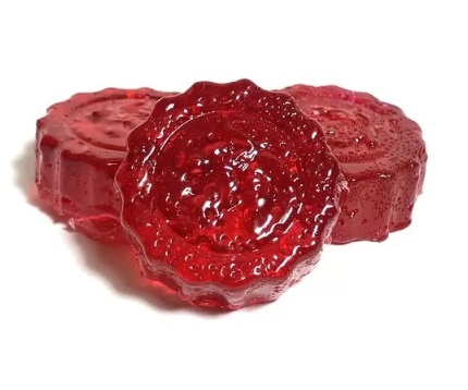 Red hard candies infused with 200mg THC, potent cannabis edible for stress and pain relief