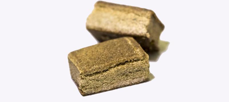 Traditional Lebanese hash blocks on a wooden surface