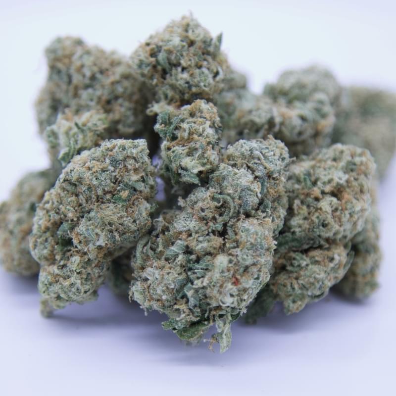 Gorilla Glue cannabis buds comparison of GG1, GG4, and GG5 showing dense trichomes and varying colors